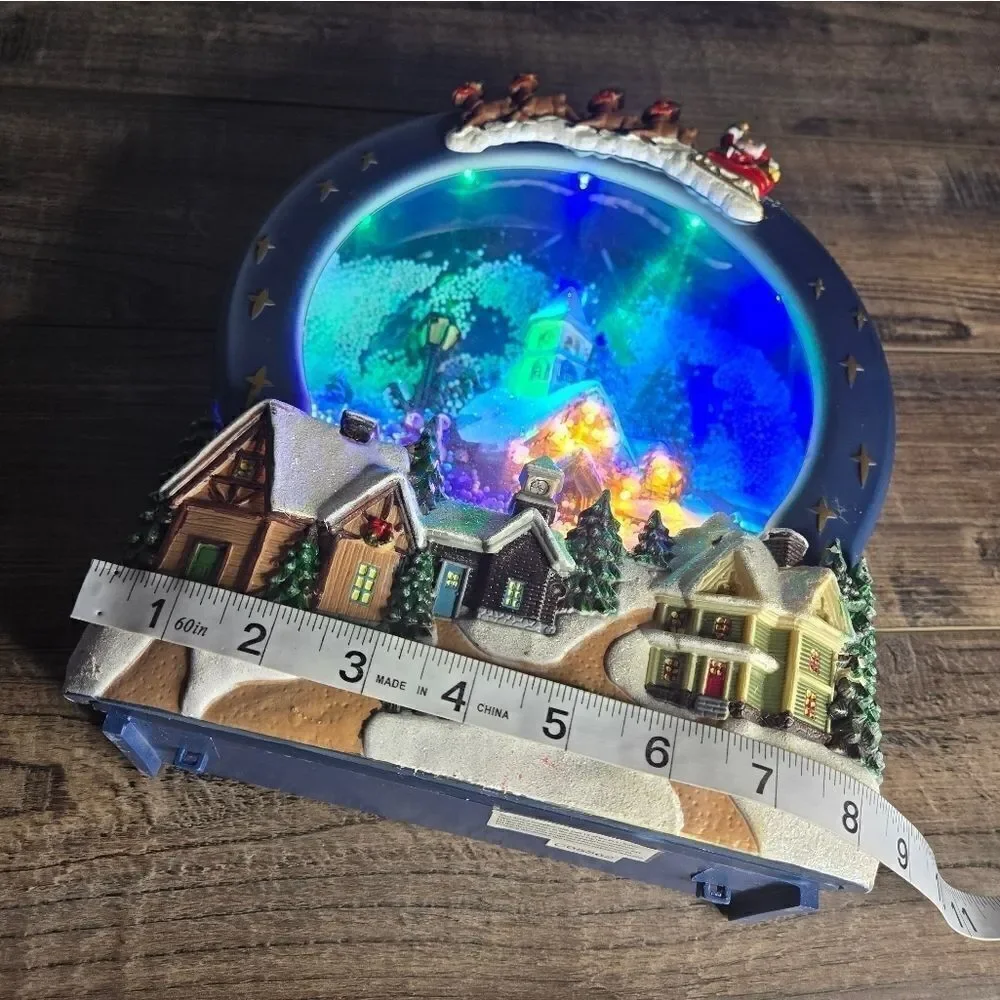 Two snow globes, animated snow, one is musical  and lights up htf